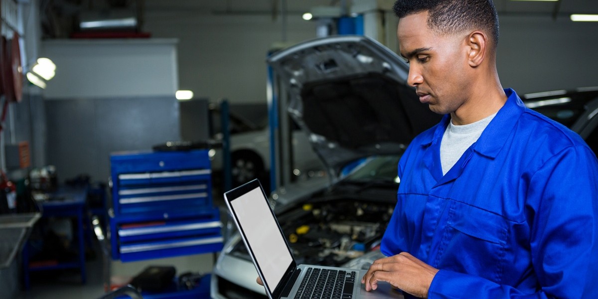 Mechanic working on laptop